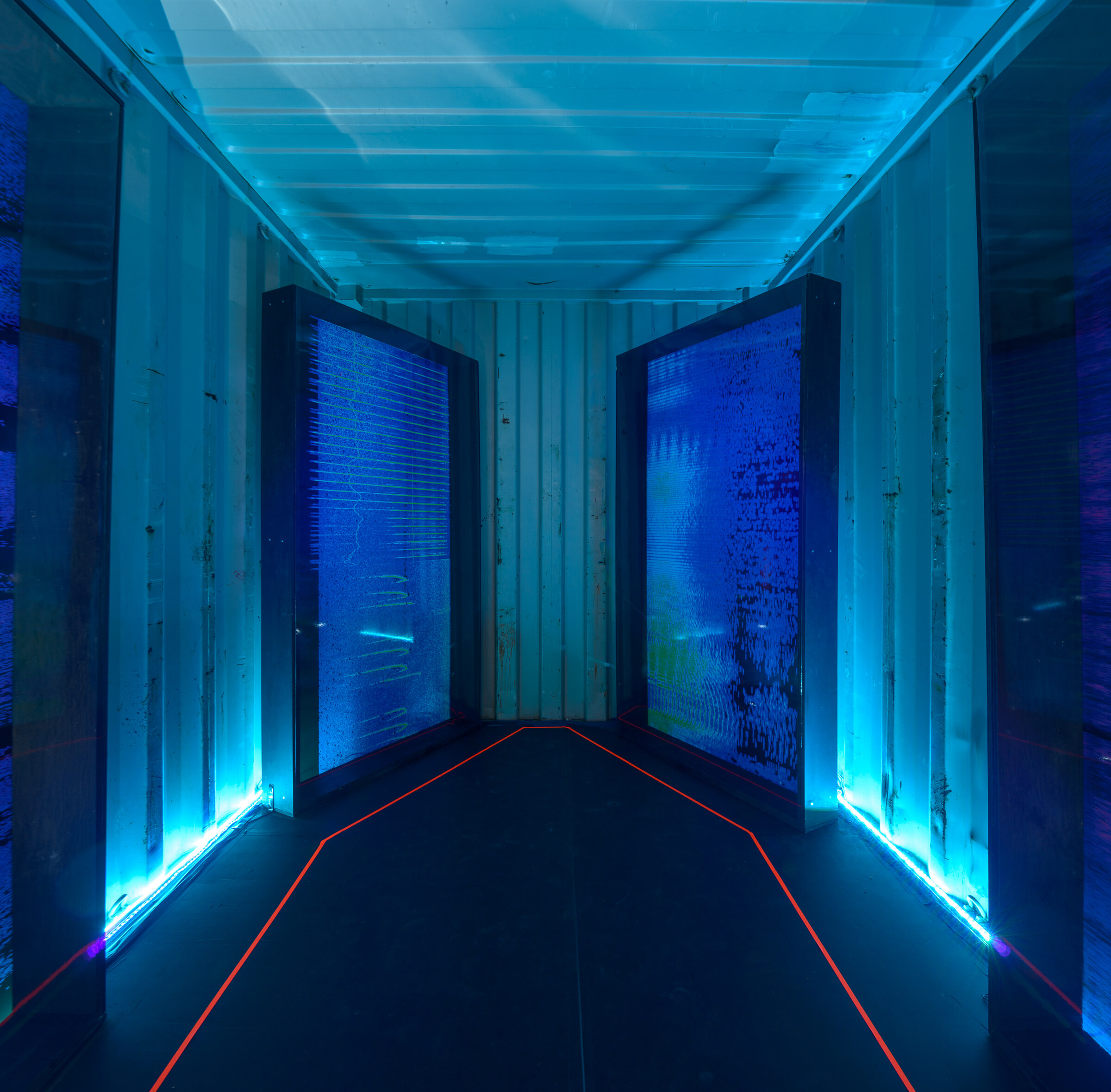 Symmetrical interior view with two panels and red LED floor path.